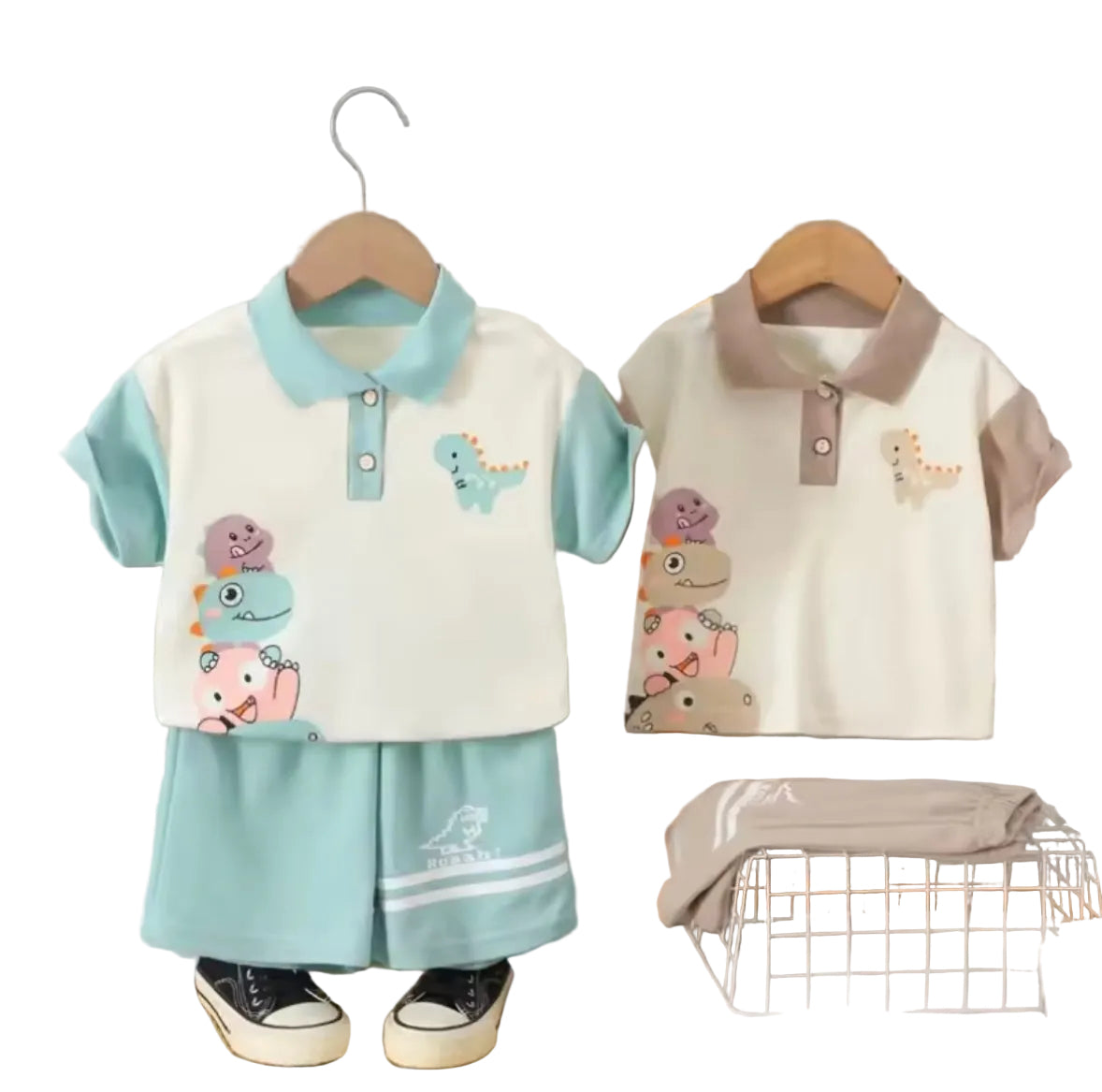 Children's clothing set with cartoon designs on hangers against a striped wall.