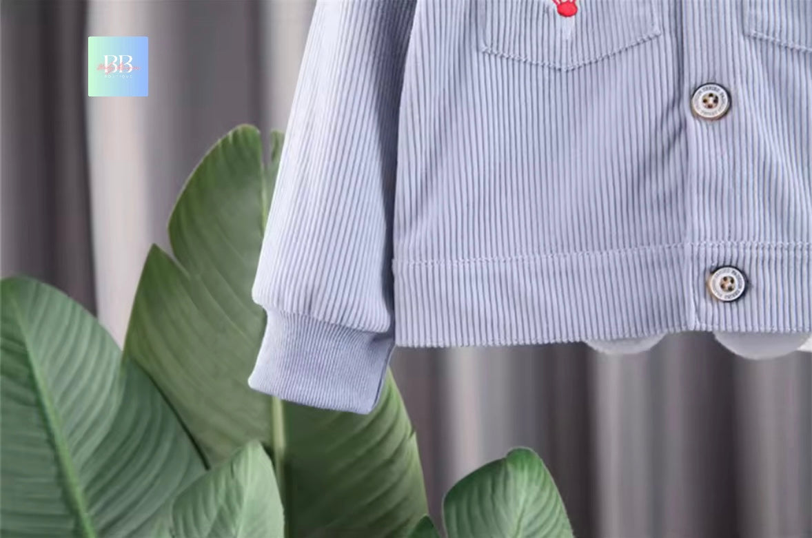 Close-up of a blue striped shirt with buttons on a neutral background