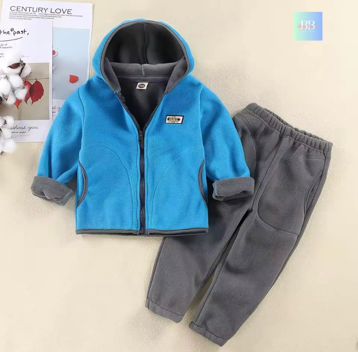 Children's blue and gray fleece jacket and pants set on a light background