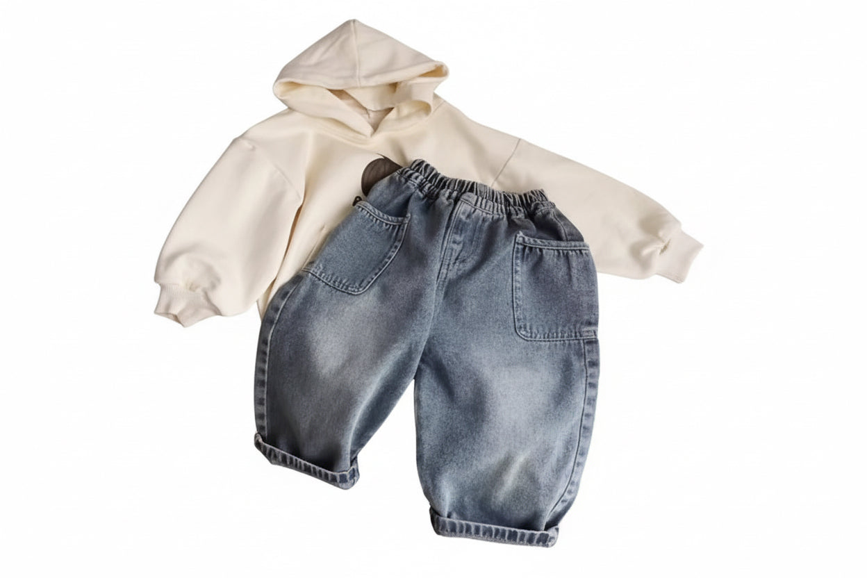 Pair of light blue denim shorts on a white surface
