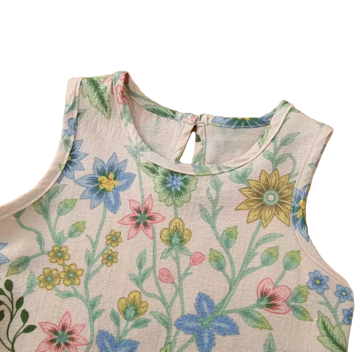 Floral-patterned sleeveless top on a wooden surface