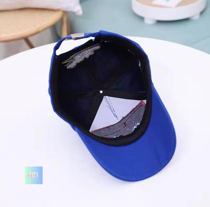 Blue cap with a reflective interior on a white surface