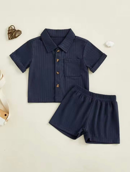 Navy pinstripe shirt and shorts set on a light beige background