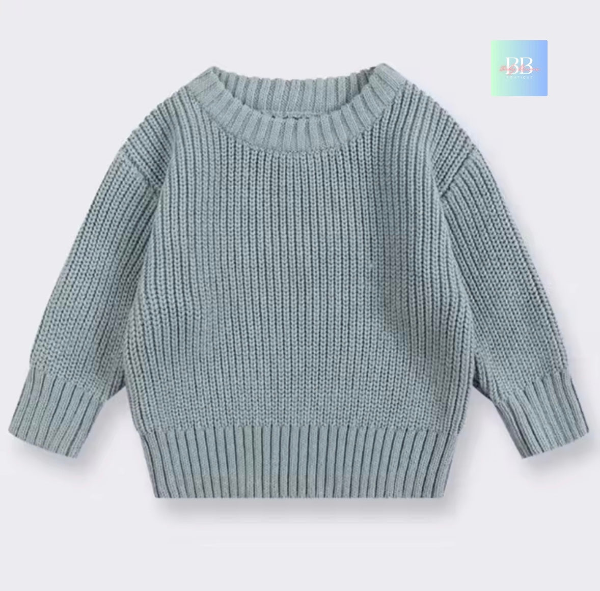Light blue knitted sweater on a white background