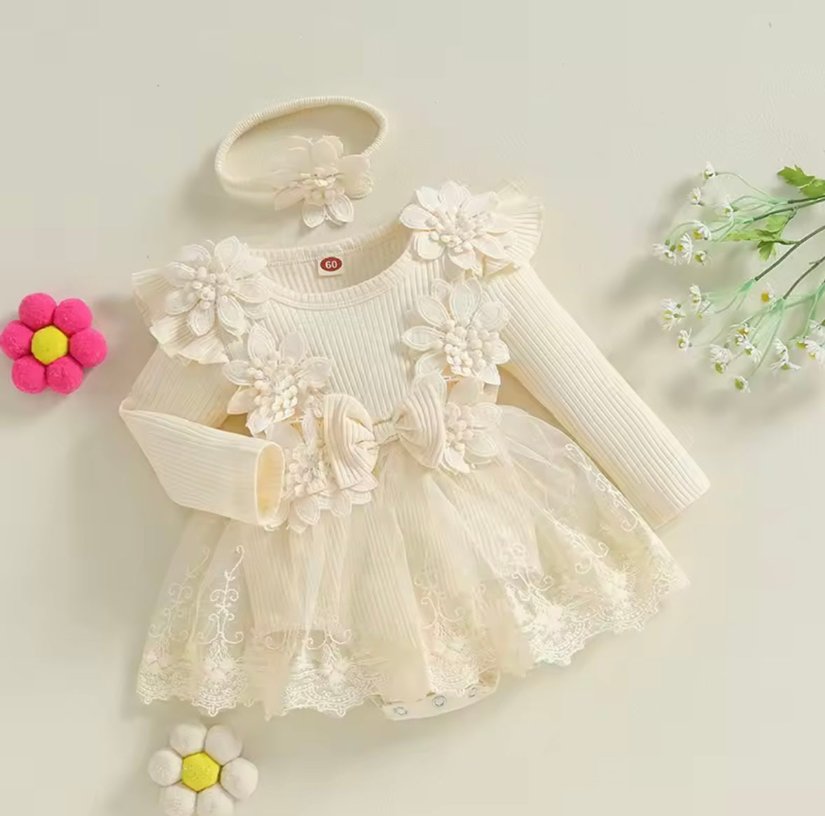 White floral dress with matching headband on a light background