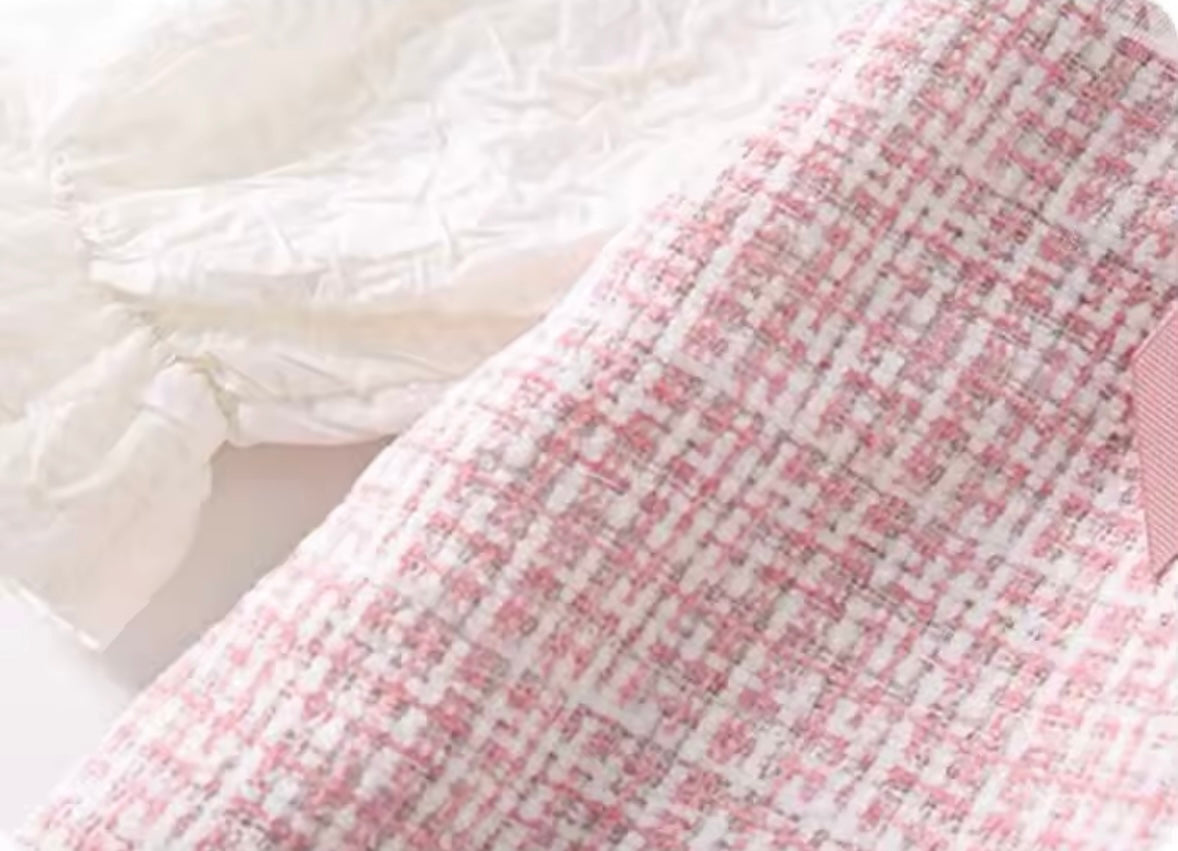 Close-up of a pink and white checkered fabric with a soft texture.