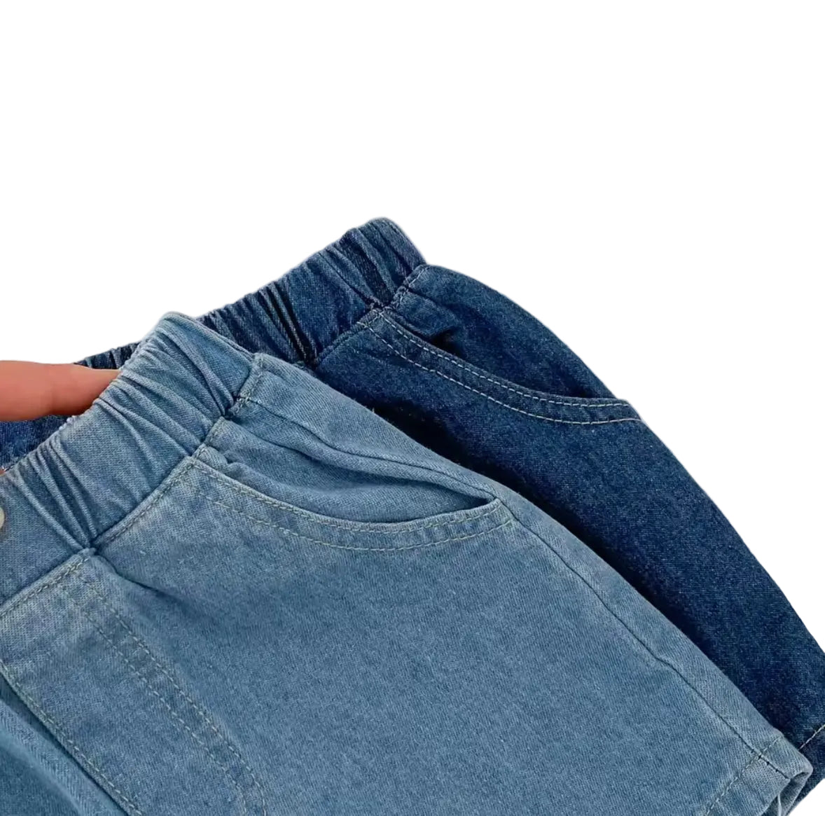 Two pairs of blue jeans stacked on a textured white surface
