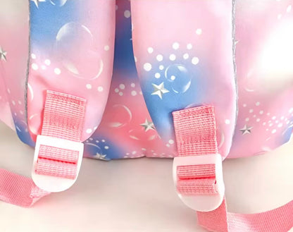 Pink and blue backpack with star and bubble designs on a white background