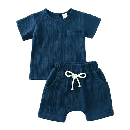 Navy blue children's outfit with a short-sleeve top and shorts on a white background