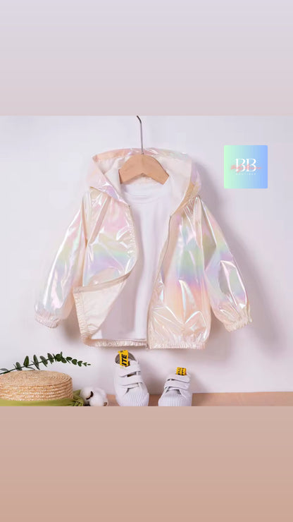 Holographic jacket on a hanger against a white wall with a beige floor.