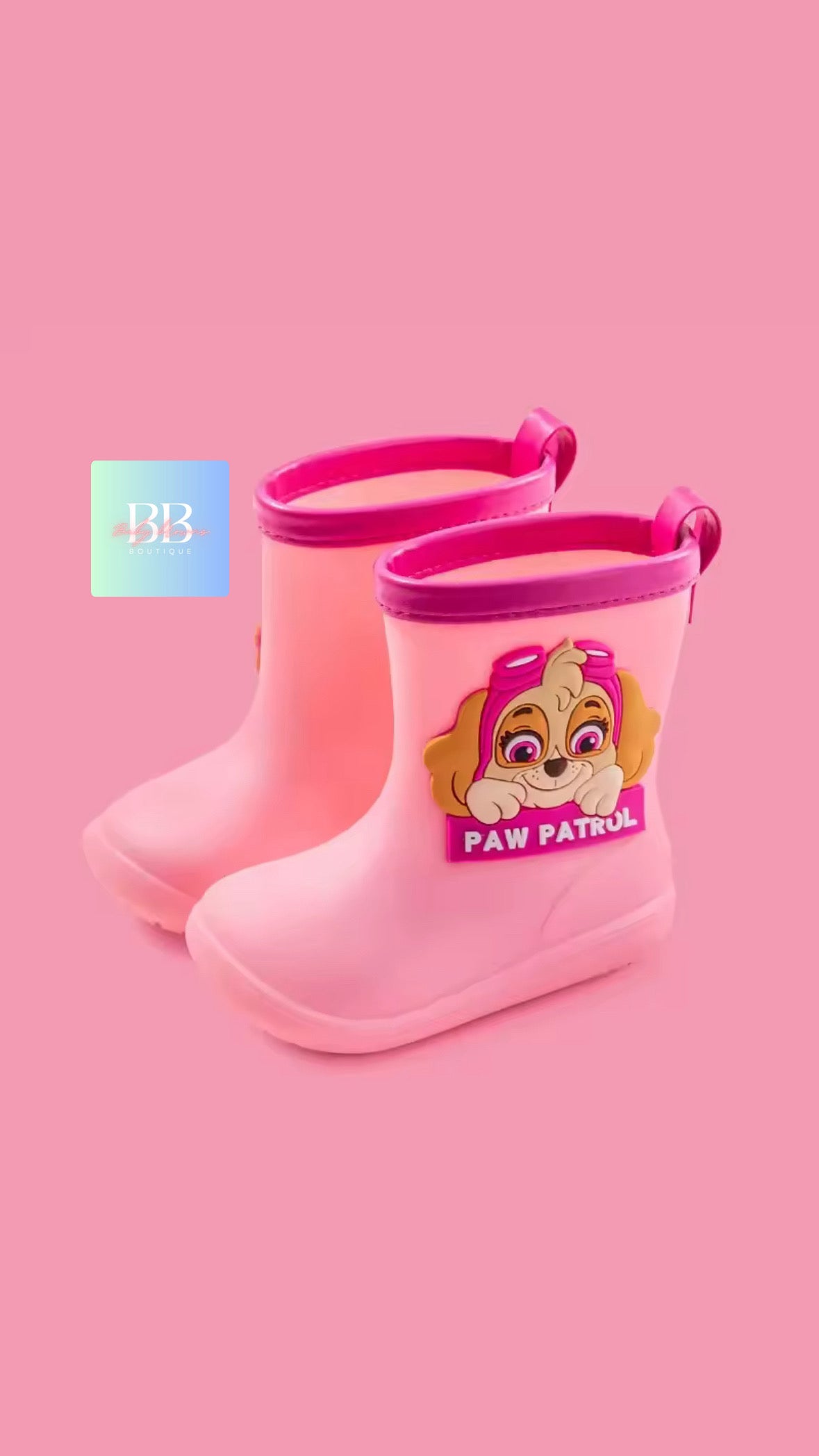 Pink rain boots with a Paw Patrol character on a pink background