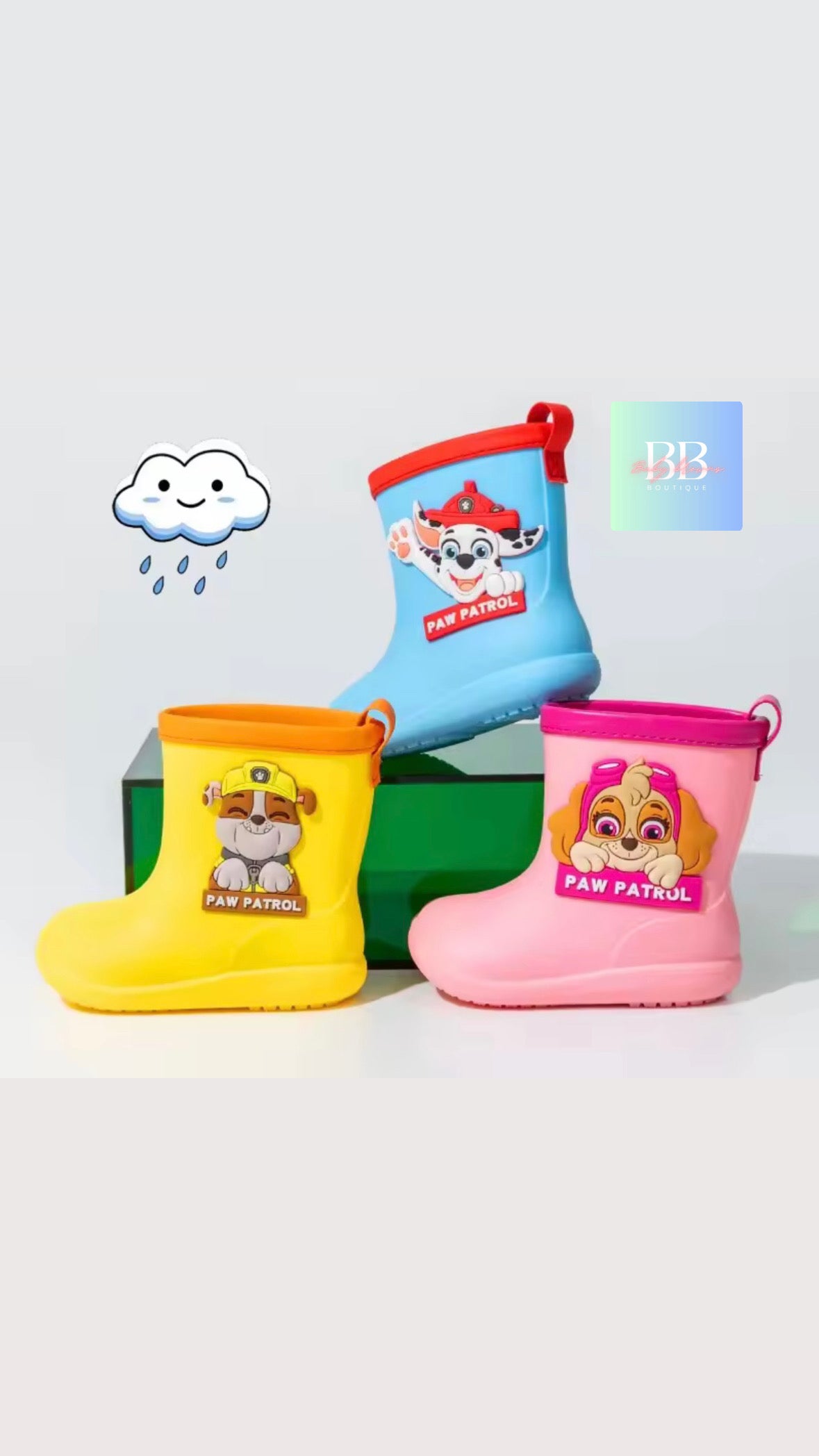 Three children's rain boots with Paw Patrol design on a white background
