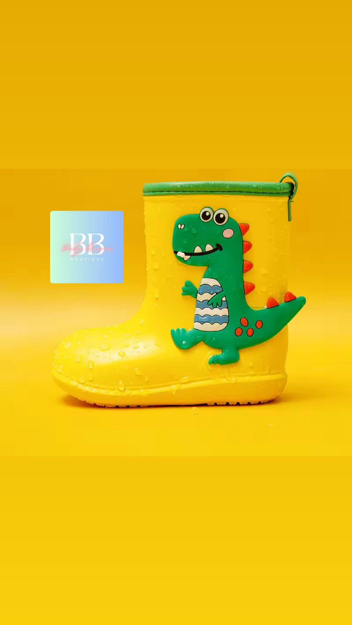 Yellow rain boot with a dinosaur design on a yellow background