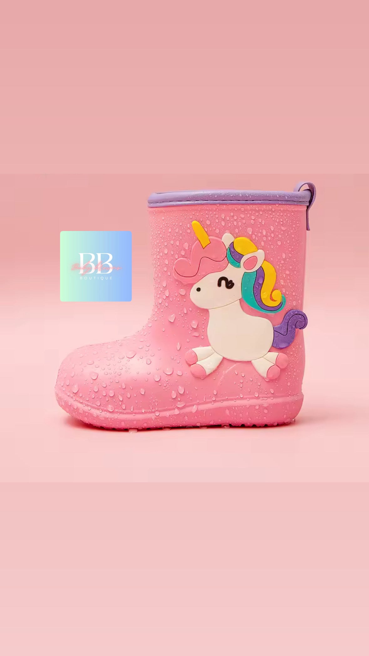Pink rain boot with unicorn design on a pink background