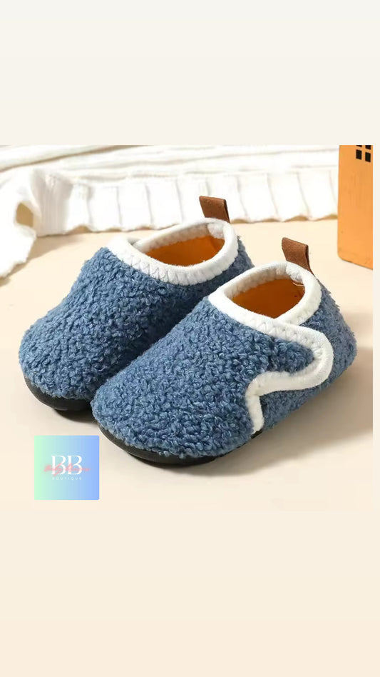 Pair of blue and white slippers on a light background