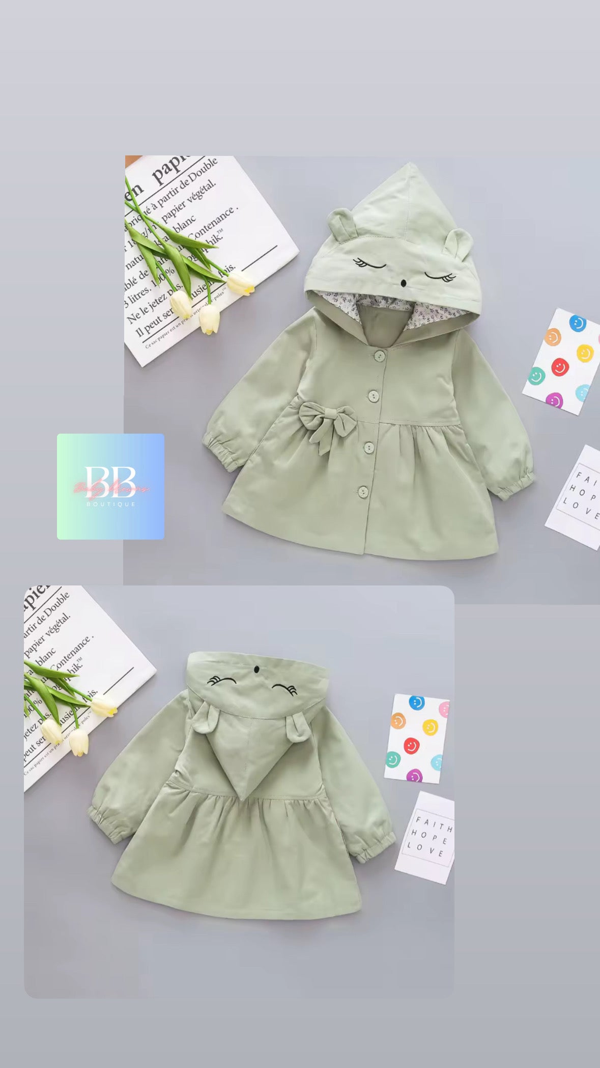 Green children's coat with hood on a light gray background
