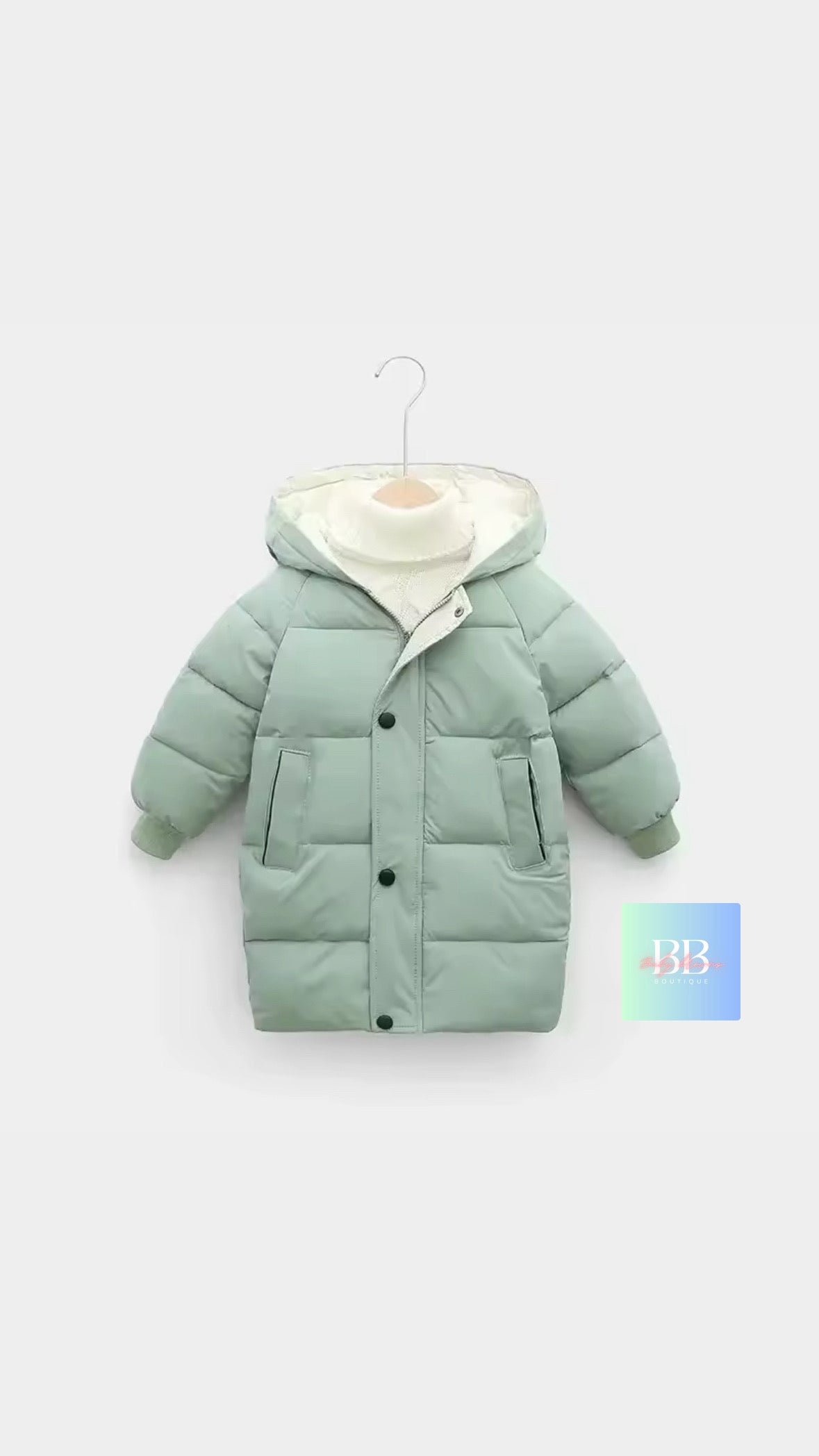 Green children's puffer jacket on a white background