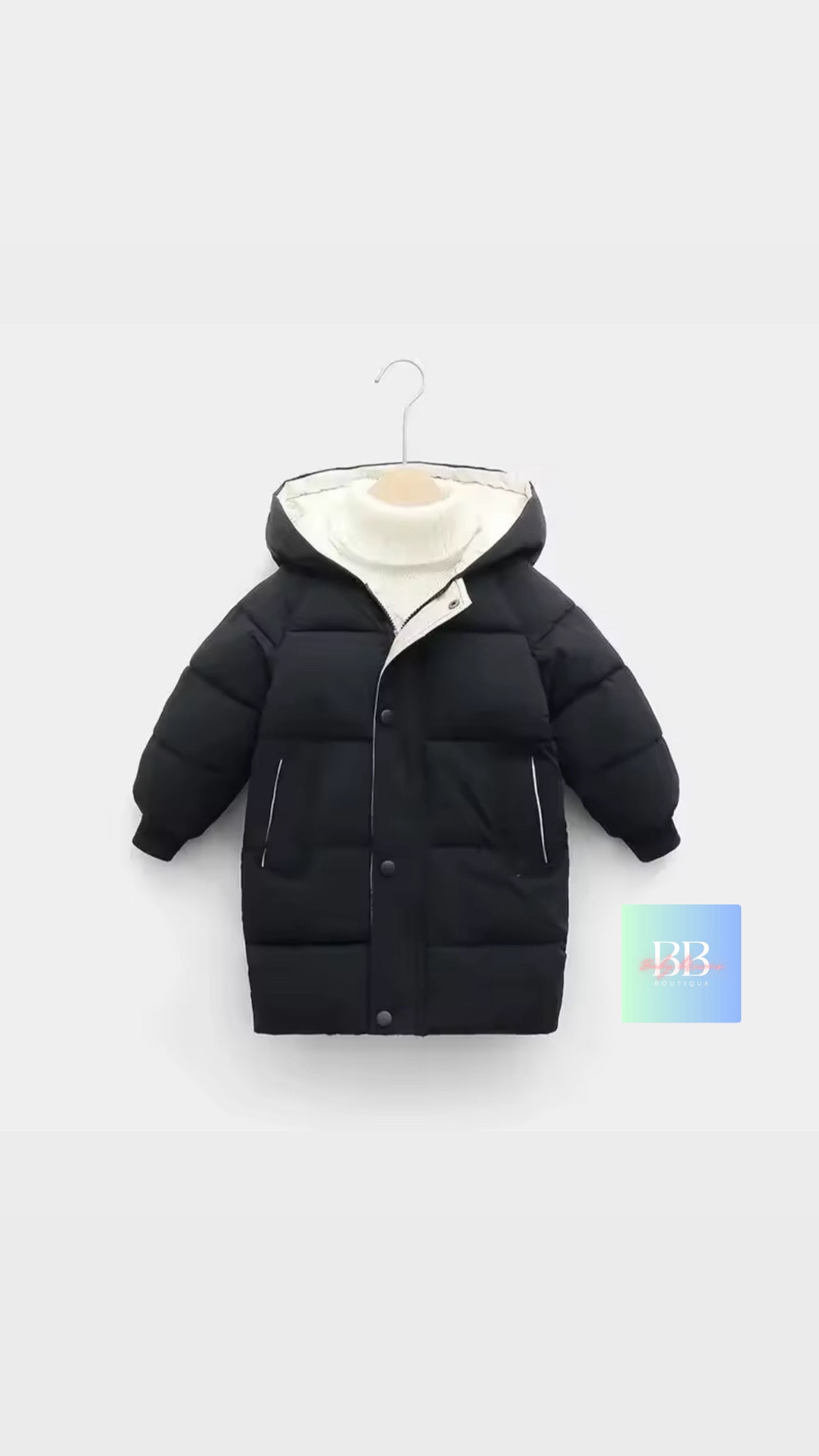 Black children's puffer jacket on a white background