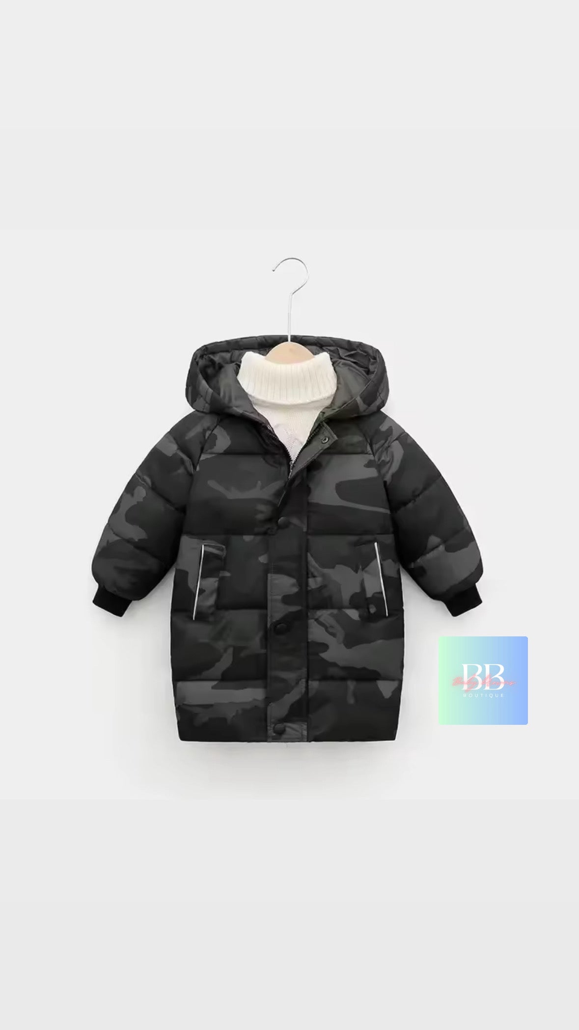Camouflage-patterned children's puffer jacket on a white background