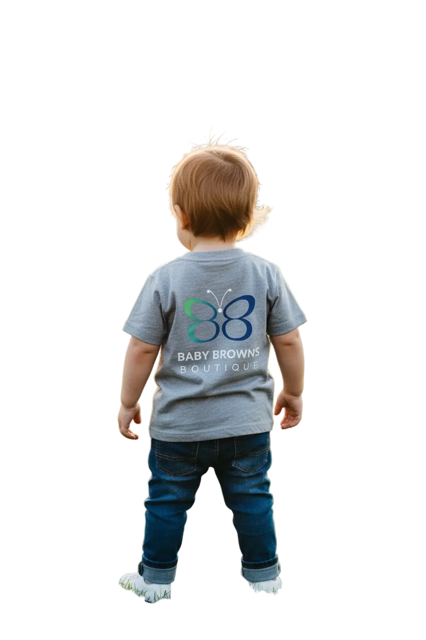 Child wearing a gray t-shirt with a logo and text, standing on a white background